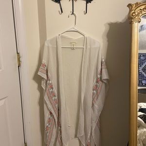 white shear shaw with pink and white floral detailing.